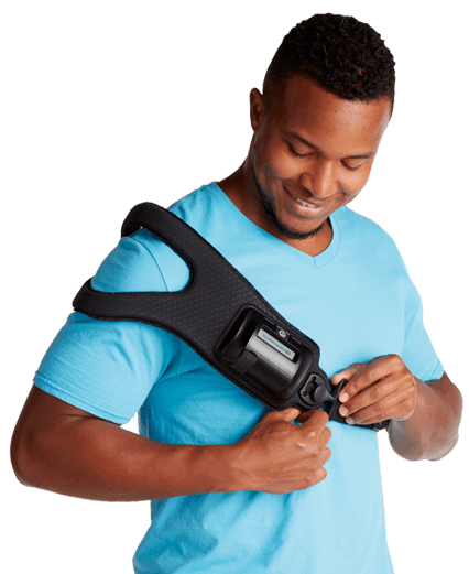 Man wearing a bone stimulator device on his shoulder