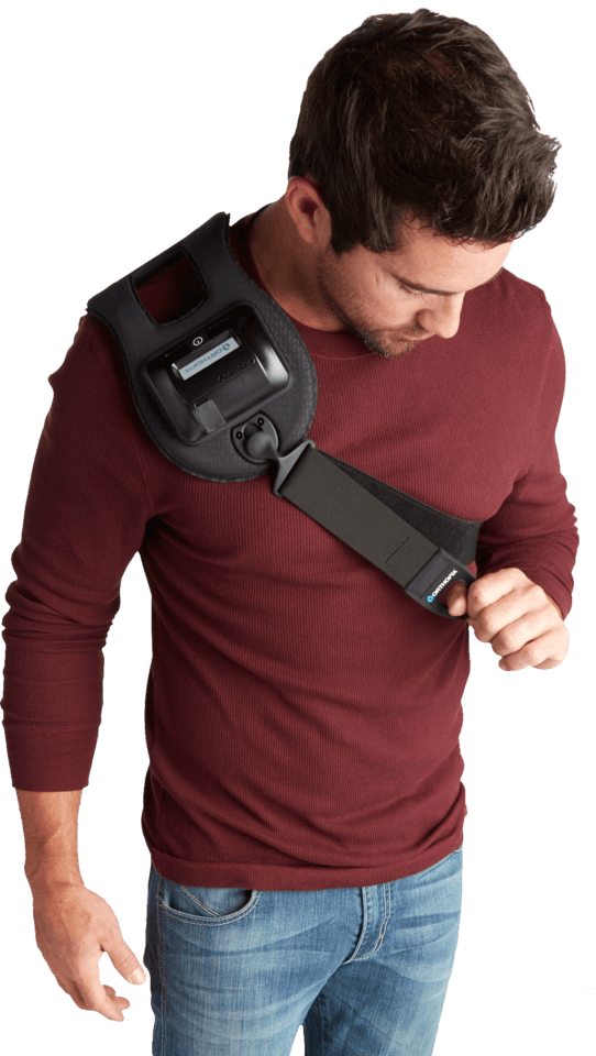 Man wearing a bone stimulator device on his collarbone