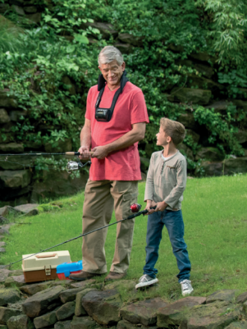 Man wearing CervicalStim device while fishing