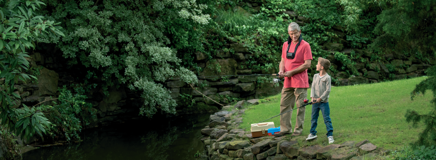 Man wearing CervicalStim device while fishing